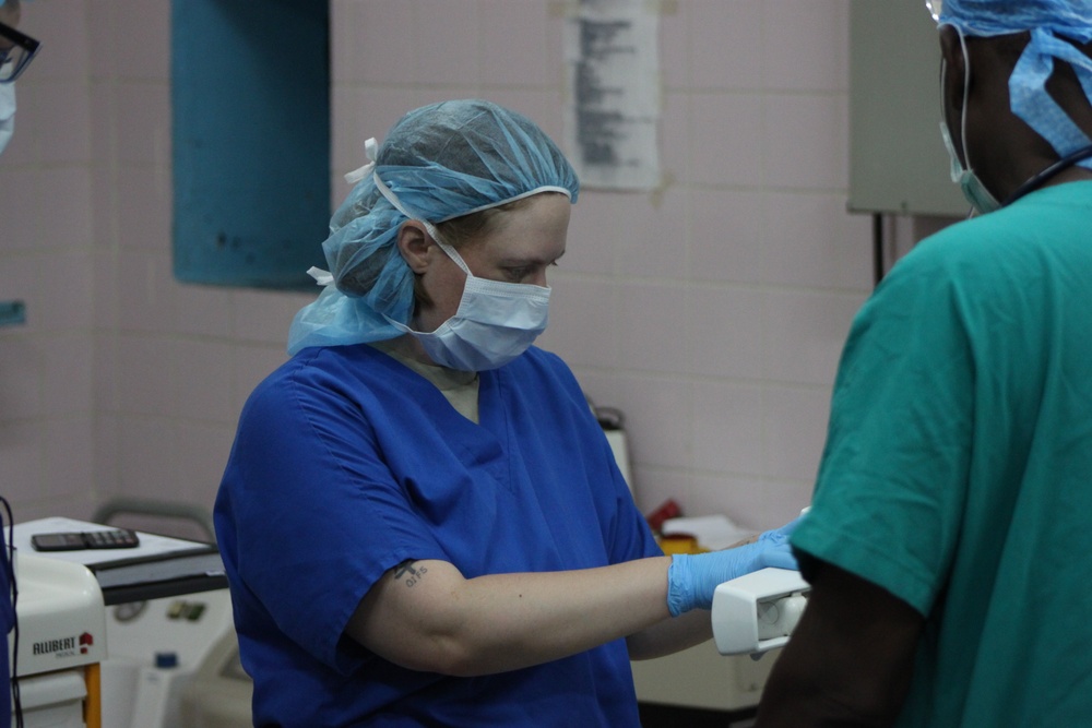 Army Reserve nurse prepares patient prior to surgery in Chad hospital