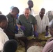 Army Reserve physician instructs medical students during demonstration on goat in Chad hospital