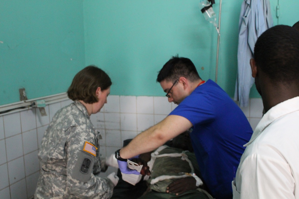 Army Reserve medical personnel provide medical care to Chadian combat wounded in Chad hospital