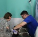 Army Reserve medical personnel provide medical care to Chadian combat wounded in Chad hospital
