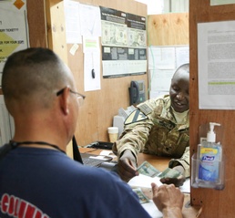 Soldier counts out cash overseas