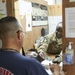 Soldier counts out cash overseas