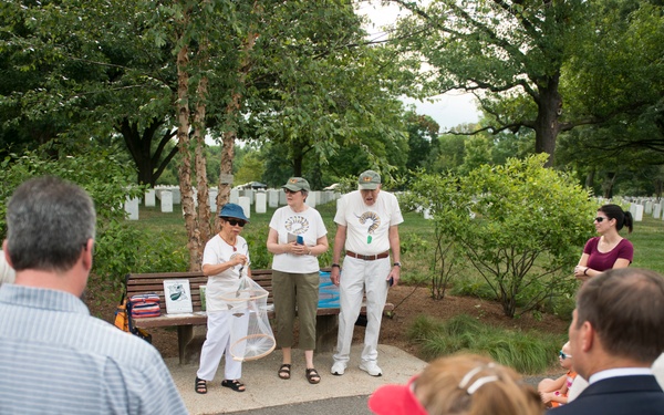 Volunteers with Monarch Teacher Network release butterflies in Arlington National Cemetery