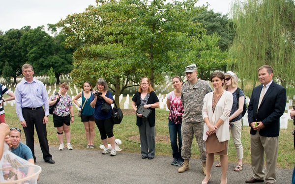 Volunteers with Monarch Teacher Network release butterflies in Arlington National Cemetery