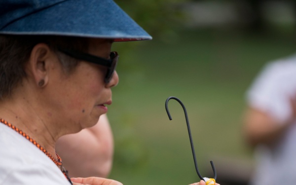 Volunteers with Monarch Teacher Network release butterflies in Arlington National Cemetery