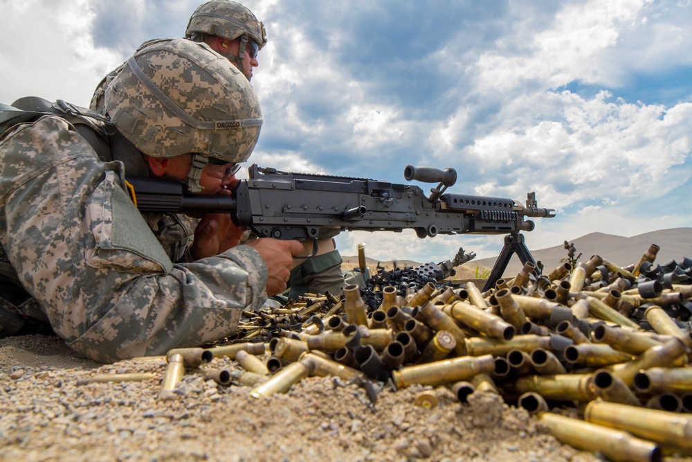 Spc. Michael S. Orozco fires M-240