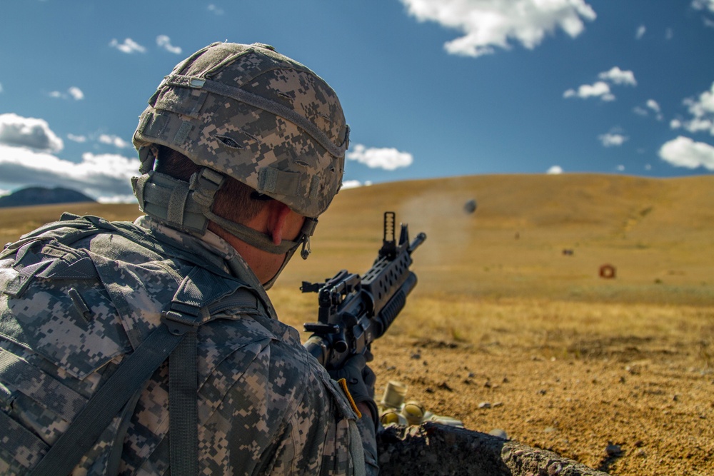 Spc. Michael S. Orozco fires M-203