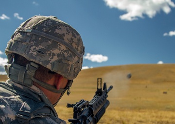 Spc. Michael S. Orozco fires M-203