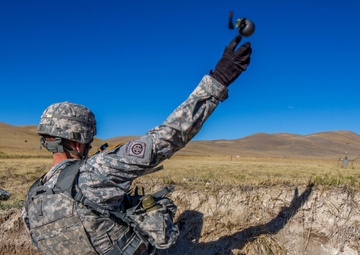 Sgt. 1st Class Robert Jones throws grenade