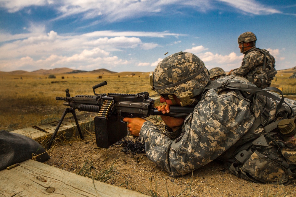 Spc. Carlo Deldonno fires M-249