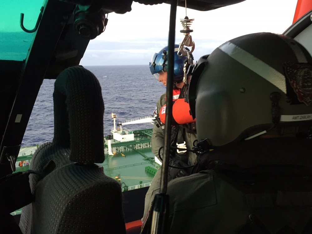 MH-65 Dolphin helicopter crew conducts medevac 14 miles south of Oahu