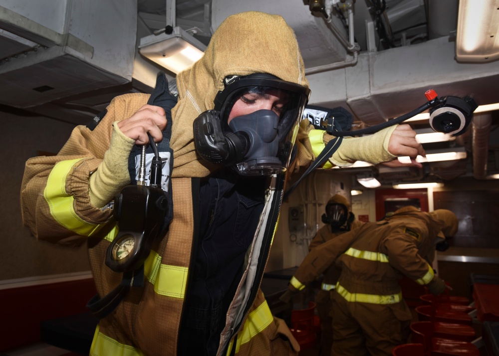 USS Shoup Sailors conduct a damage control drill
