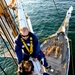 Coast Guard Cutter Eagle crewmembers repair damaged sails while underway
