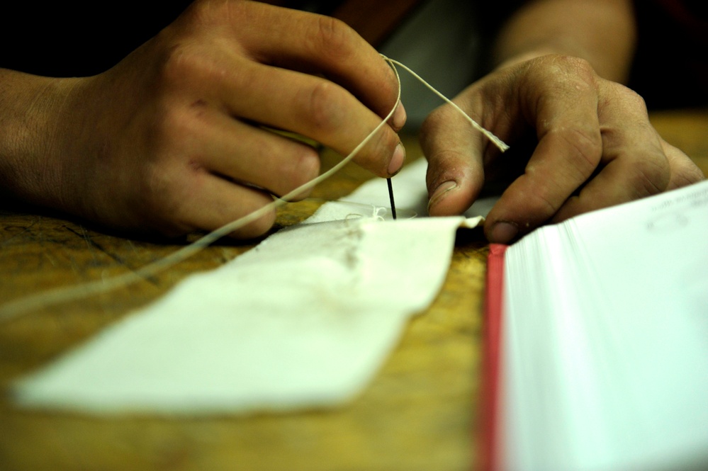 Coast Guard Cutter Eagle crewmembers learn and practice sewing sails
