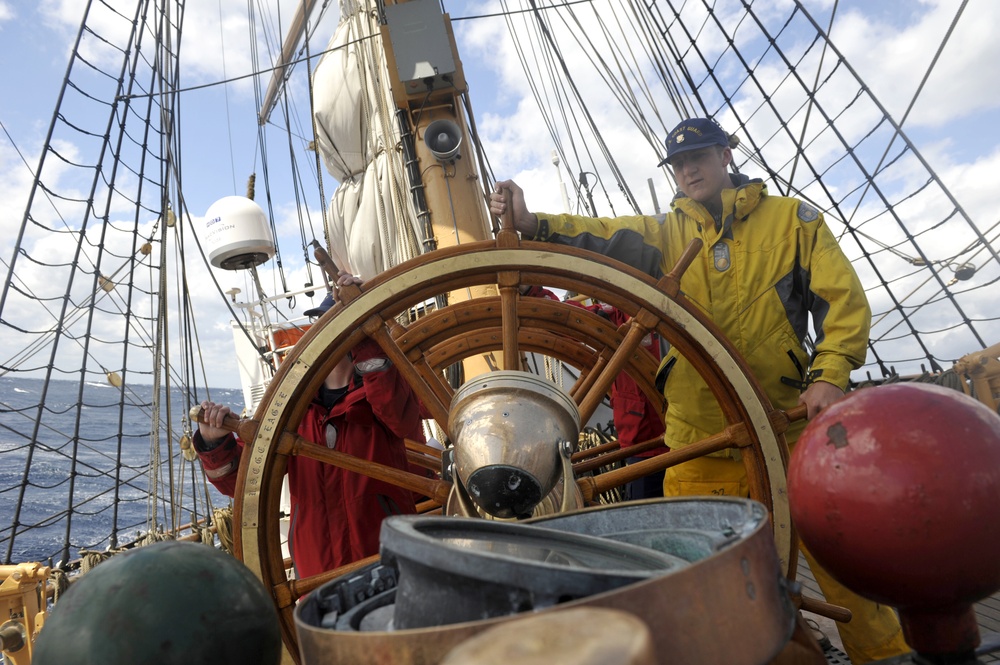 Coast Guard Cutter Eagle crewmembers and Officer Candidates work together during sail stations
