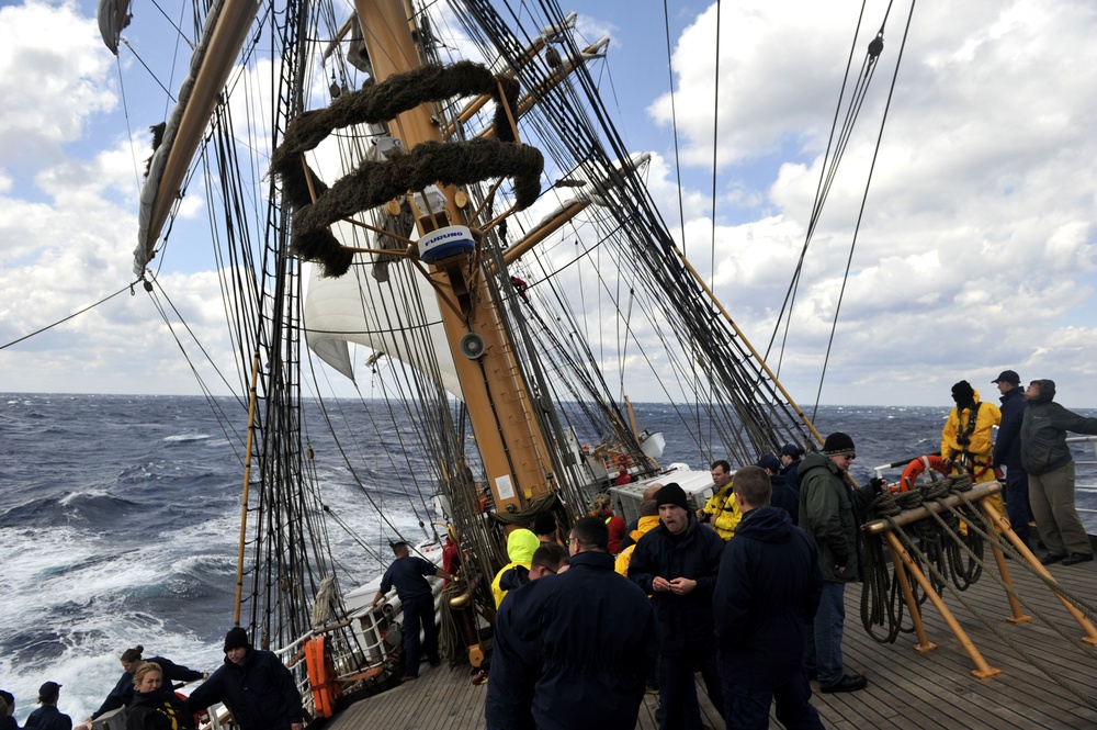 Coast Guard Cutter Eagle crewmembers and Officer Candidates work together during sail stations