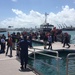 Boat crews bring passengers from the vessel Caribbean Fantasy ashore to Pier 6 in San Juan, Puerto Rico on August 17, 2016.