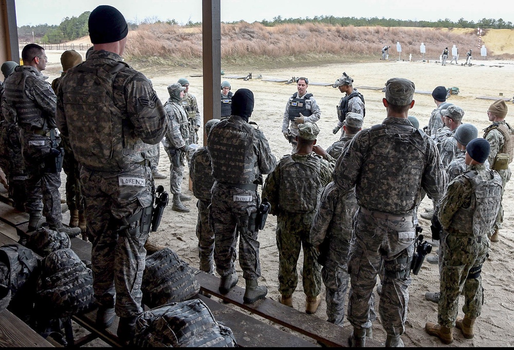 Phoenix Raven instructor gives weapons training brief