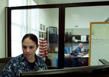 Petty Officer 1st Class Mariana Aragon processes the orders for over 150 Reservists who are participating in the Rim of the Pacific Exercise 2016.