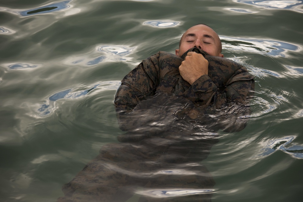 U.S. Marines, French Army soldiers swim through floating obstacle course