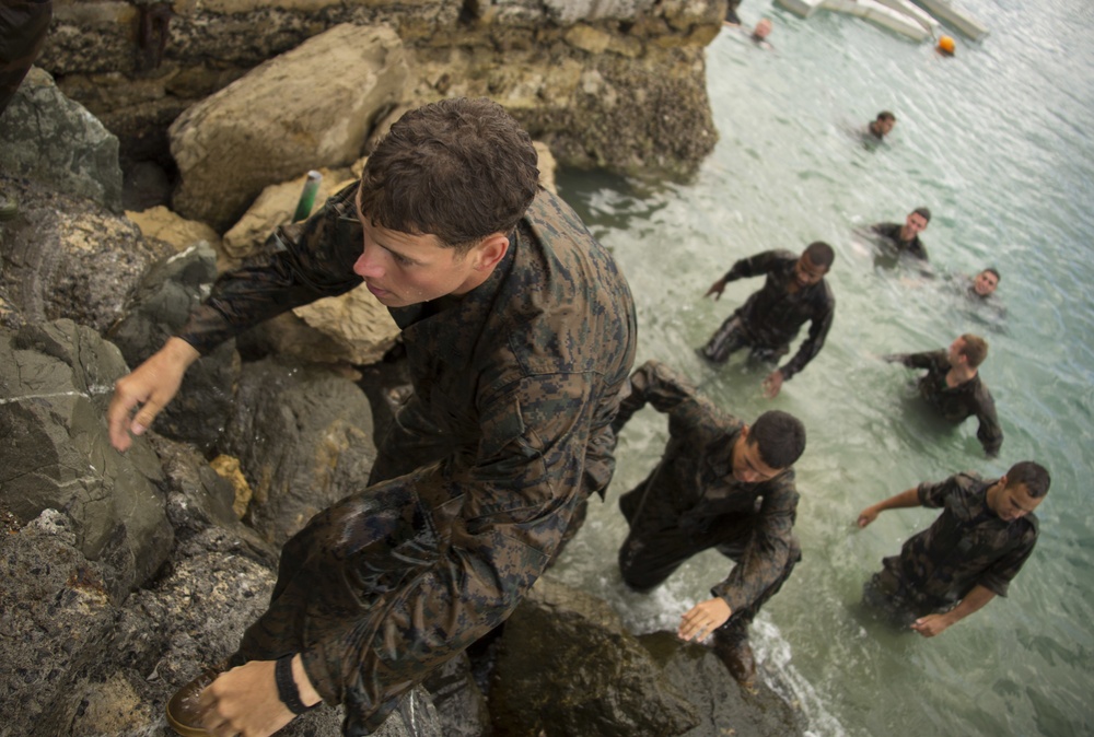 U.S. Marines, French Army soldiers swim through floating obstacle course