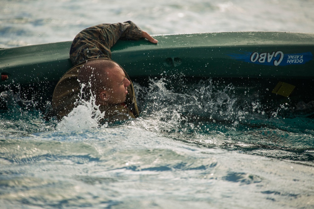 Troops overboard: U.S. Marines, French Army soldiers paddle out to Orphelinat Bay