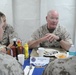 Maj. Gen. W. Lee Miller, Commanding General, 2 Marine Expeditionary Force, speaks with Marines during lunch on the mess decks of the amphibious assault ship USS Bataan (LHD-5).