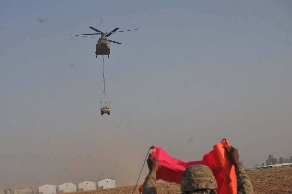 ask Force Strike Artillerymen, aviators conduct sling load training