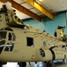 U.S. Army Air Crews conduct routine maintenance on a CH-47 Chinook