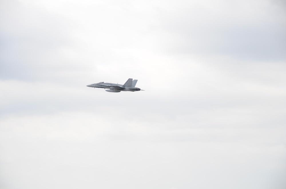 United States Navy F/A-18 Super Hornet flies over the skies of Vermont