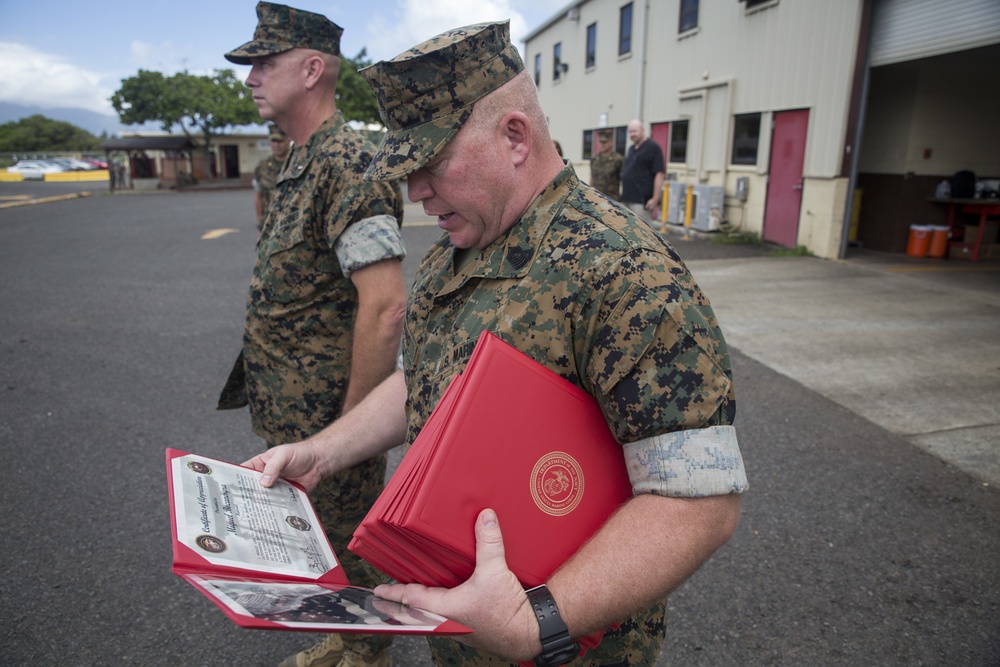 III MEF Marines present certificates of appreciation to Oshkosh Defense contractors