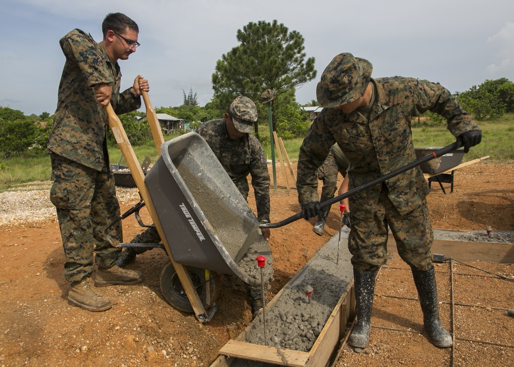 Marines with SPMAGTF-SC and Honduran engineers work together on Republica de Cuba school project footer