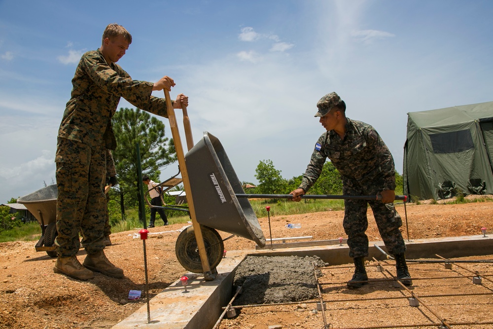 Marines with SPMAGTF-SC and Honduran Engineers work together on Republica de Cuba school project foundation