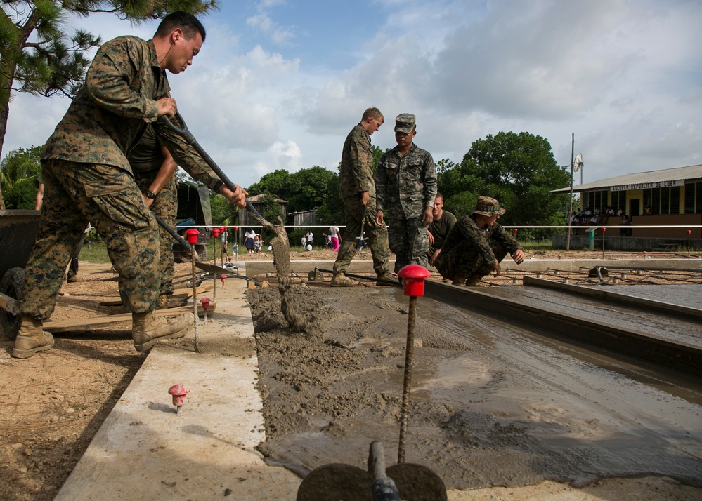 Marines with SPMAGTF-SC and Honduran engineers work together on Republica de Cuba school project foundation
