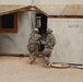U.S. Soldiers sweep through buildings