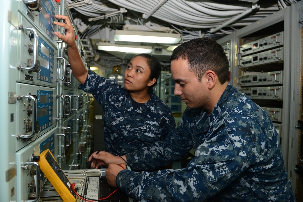 nformation Systems Technician 2nd Class Laura A. Hale, a Patuxent River, Md. native, and Electronics Technician 3rd Class Martin Rodriguez, a Nogales, Ariz. native, work together troubleshooting a high frequency receiver in the radio room aboard the amphi