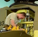 U.S. Army Air Crews conduct routine maintenance on a CH-47 Chinook