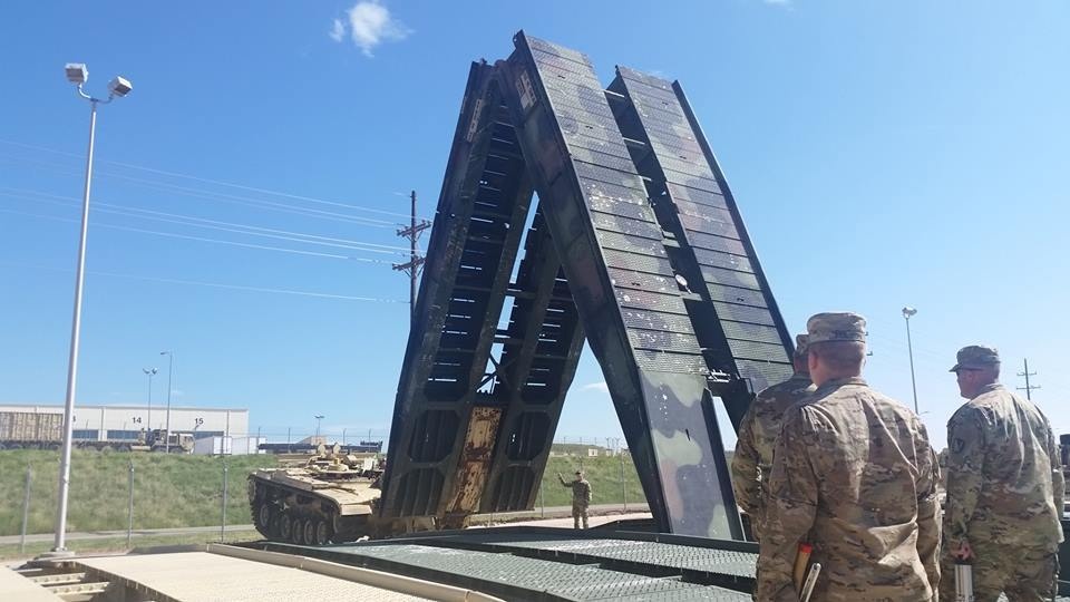 1SG Bills and SFC Yuke supervise and motivate Soldiers during the recovery of a MLC 85 tactical bridge by an AVLB during 569th MAC Command Maintenance.