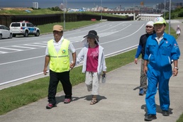 Okinawa residents participate in a tsunami evacuation drill aboard Camp Foster