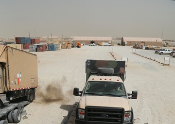 PFC guides truck onto trailer