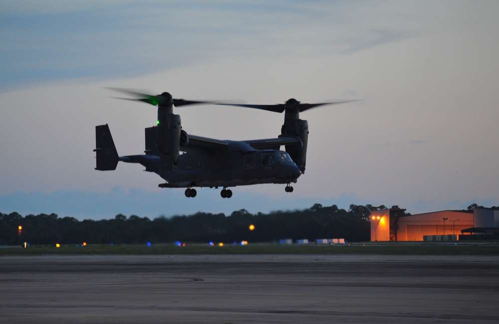 Crew chiefs guide in a CV-22B Osprey