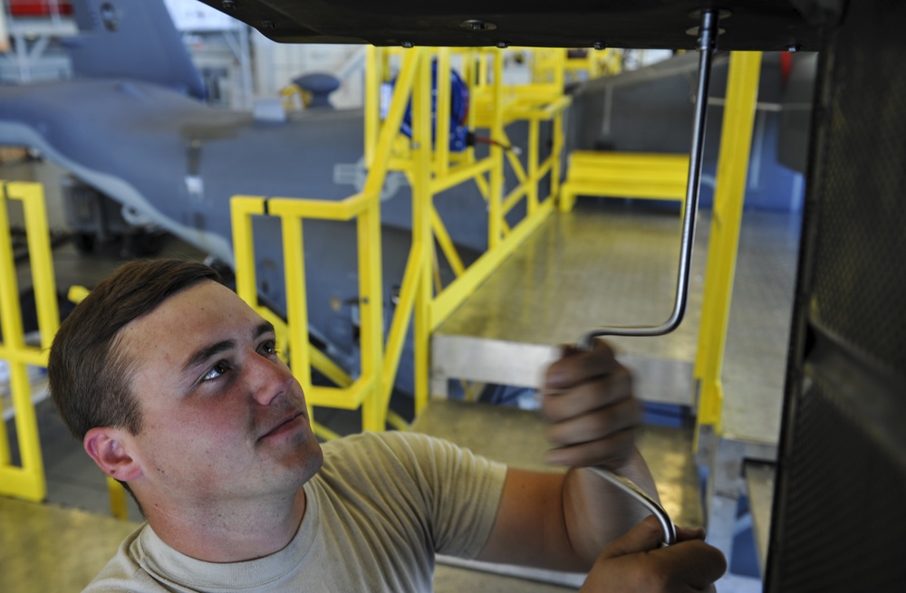 801st SOAMXS Airmen perform maintenance on a CV-22B Osprey