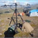 Donald Decker sets up remote communications gear in Nome