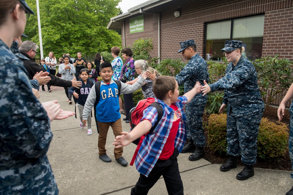 Naval Base Kitsap Sailors form victory tunnel at Sand Hill Elementary School