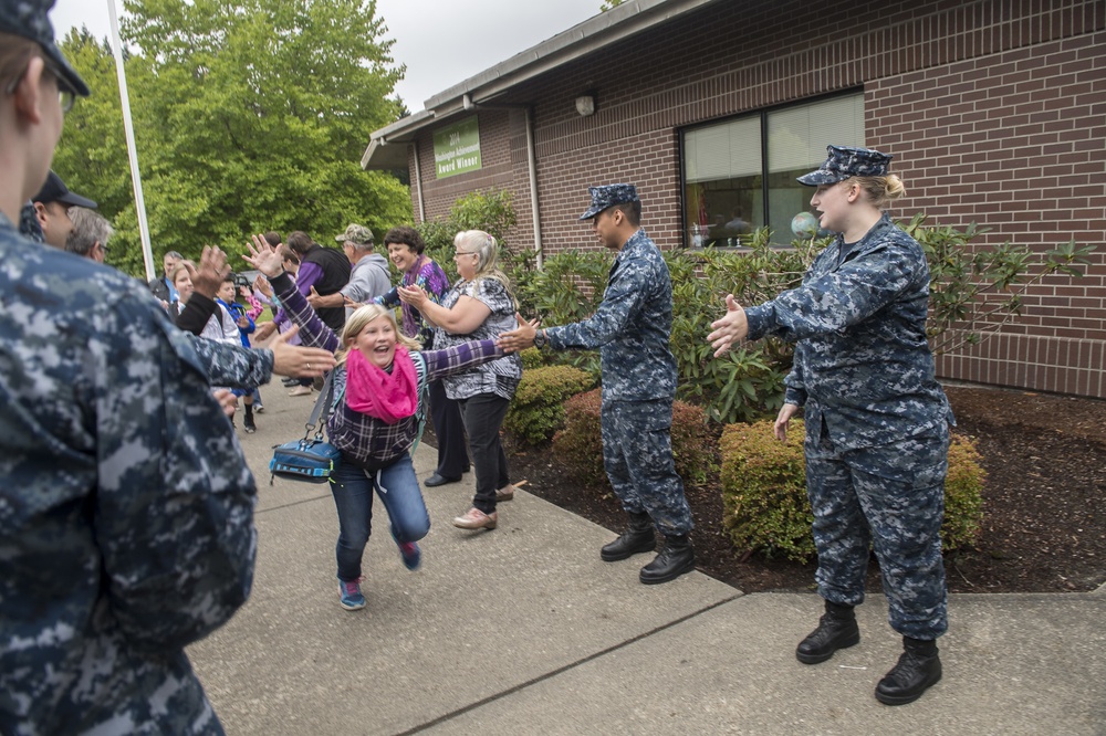 Naval Base Kitsap Sailors form victory tunnel at Sand Hill Elementary School