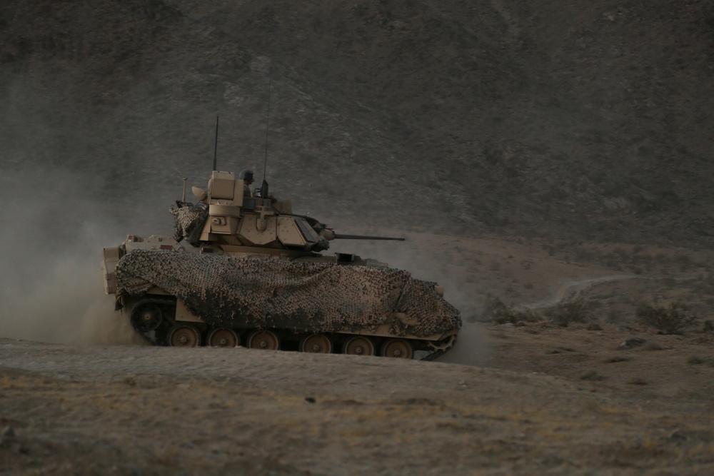 U.S. Army Soldiers maneuver through the terrain