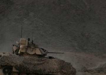 U.S. Army Soldiers maneuver through the terrain