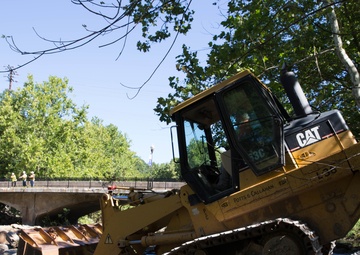 Removal of flood debris restricting drainage in Ellicott City