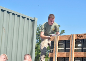 Military Sealift Command unloads cargo from USNS Sacagawea