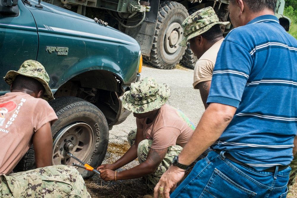 Seabees Change Local's Flat Tire